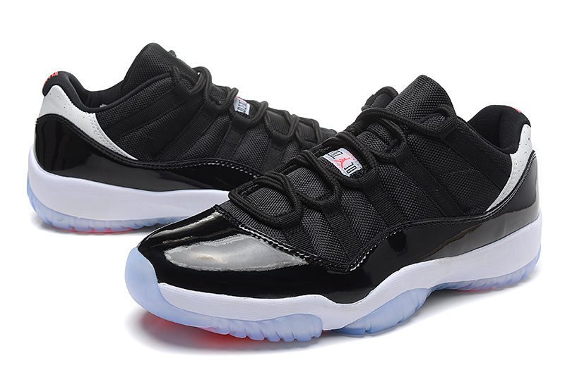 black white low top 11s